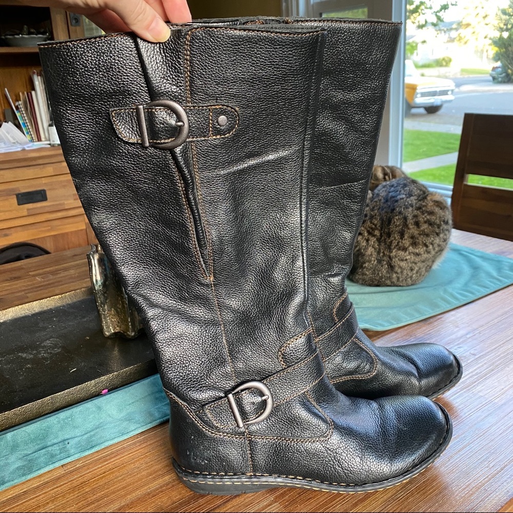 Black leather mid calf boots.